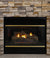 Cozy gas fireplace with flickering flames, stacked logs, and a stone mantle, protected by a glass screen