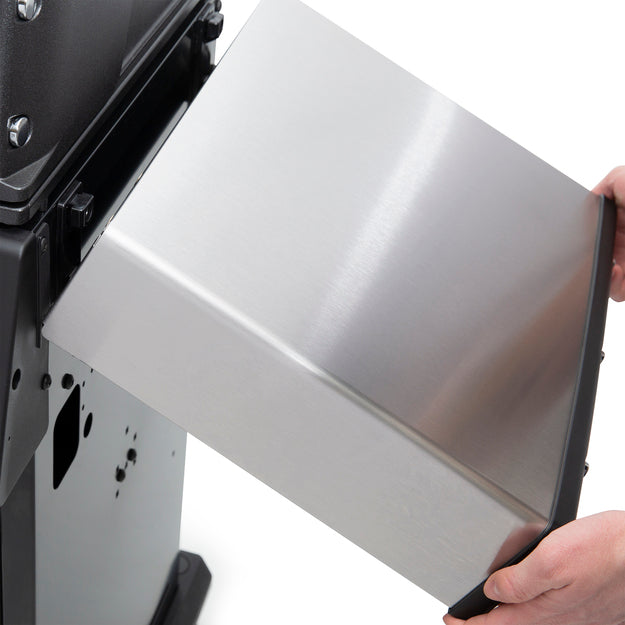 Convenient collapsible side shelf of the BroilKing Baron 440 Pro grill, allowing for easy storage and space-saving functionality