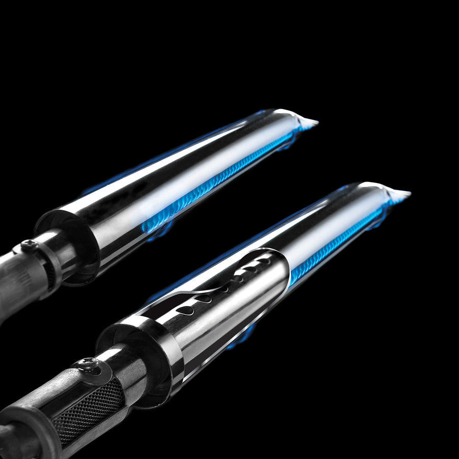 Close-up of BroilKing Crown 420's dual tube side burners with mesmerizing blue flames